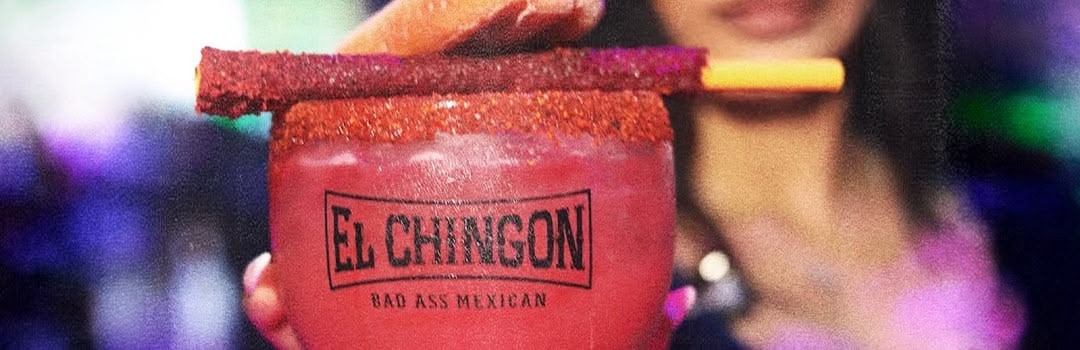photo of a Badass cocktail being served by a waitress